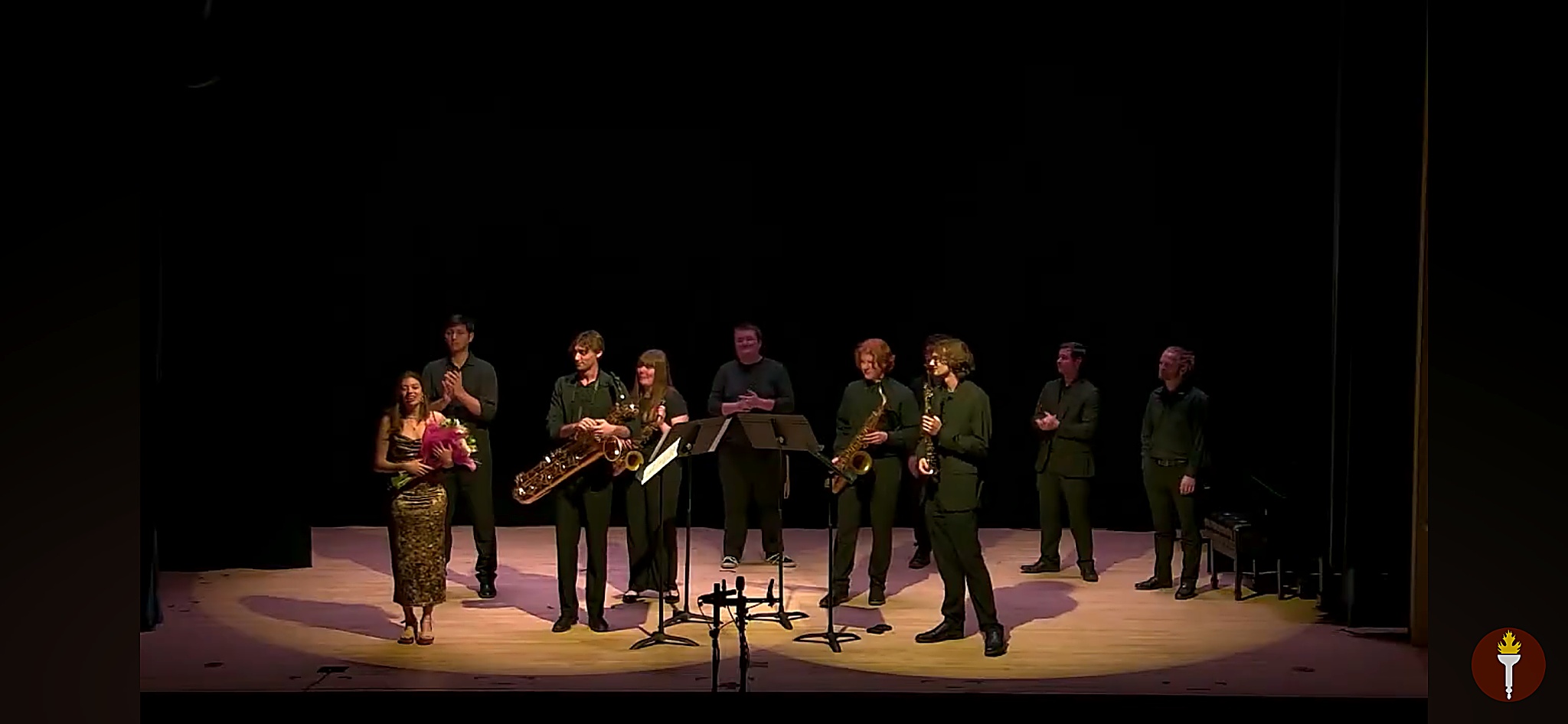 Arianna C. Gallo with ensemble on stage